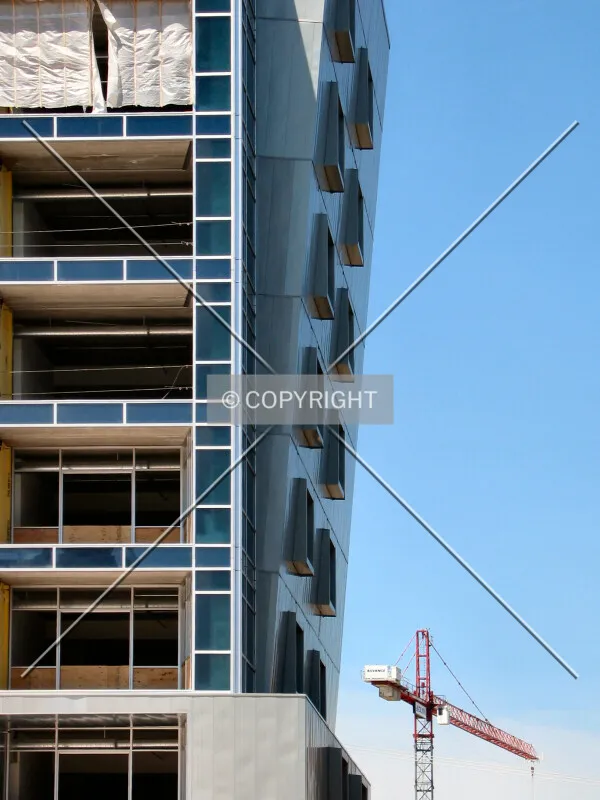 Punch windows in the angled zinc facade