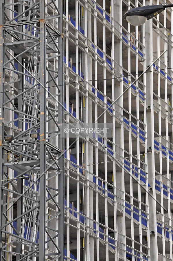 Stick frame for the curtain wall on the east facade of the parking podium, the glass has yet to be installed