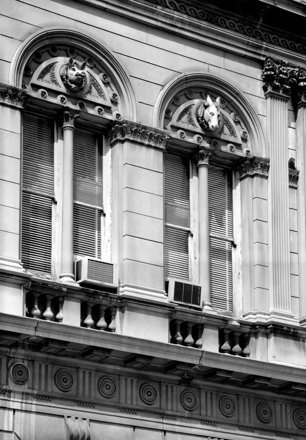 Animal heads on window arches from the southeast