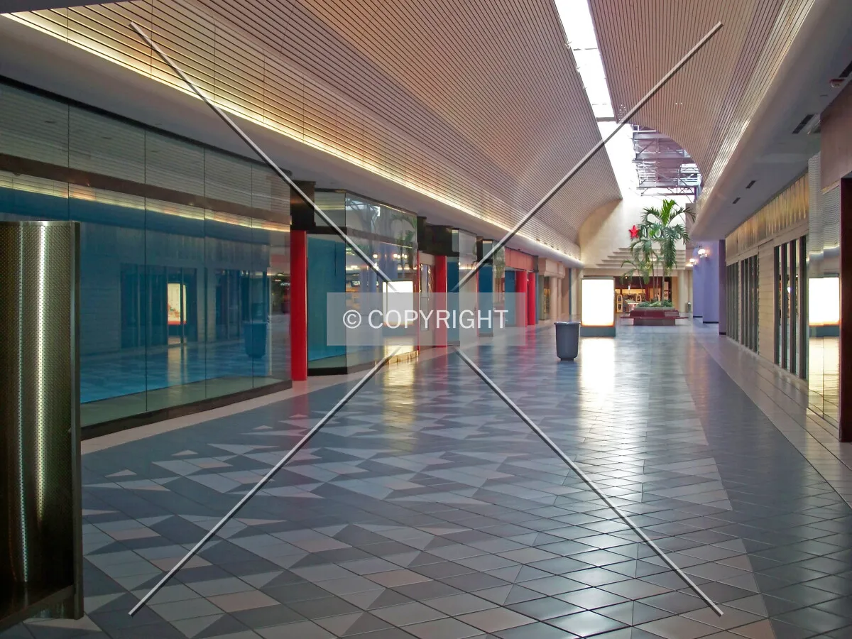 Looking down a hallway of empty storefronts towards the Macy's Department Store; January 11, 2008