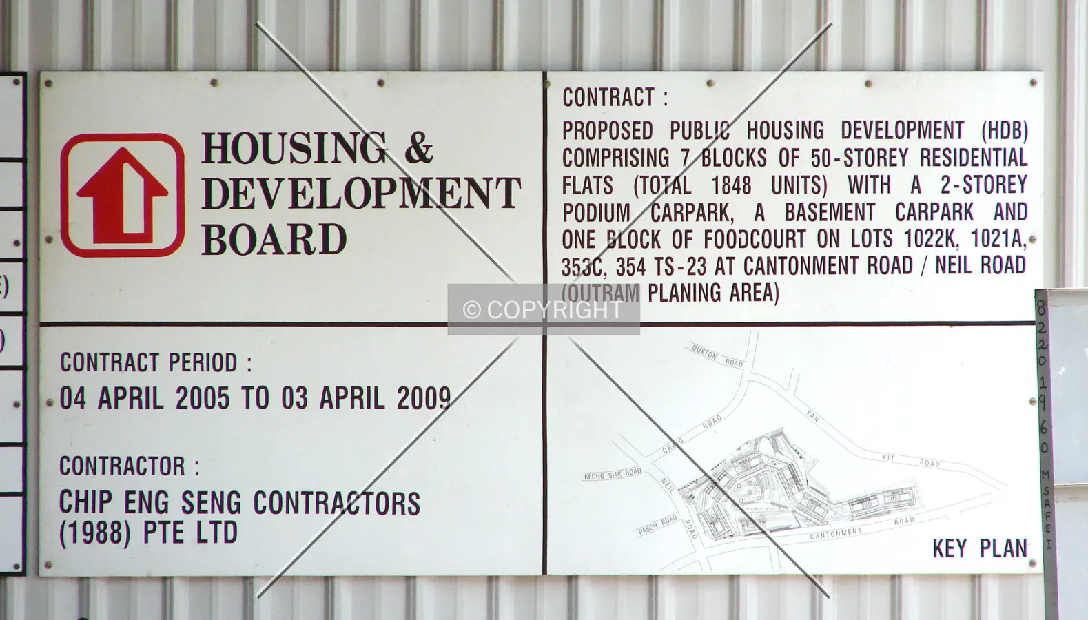Sign displayed on construction site fence