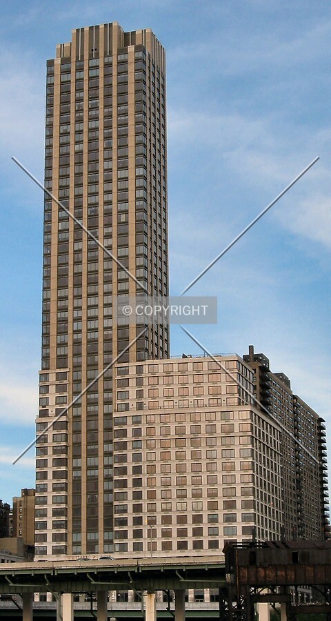 West facade in early evening light, from a Hudson River pier