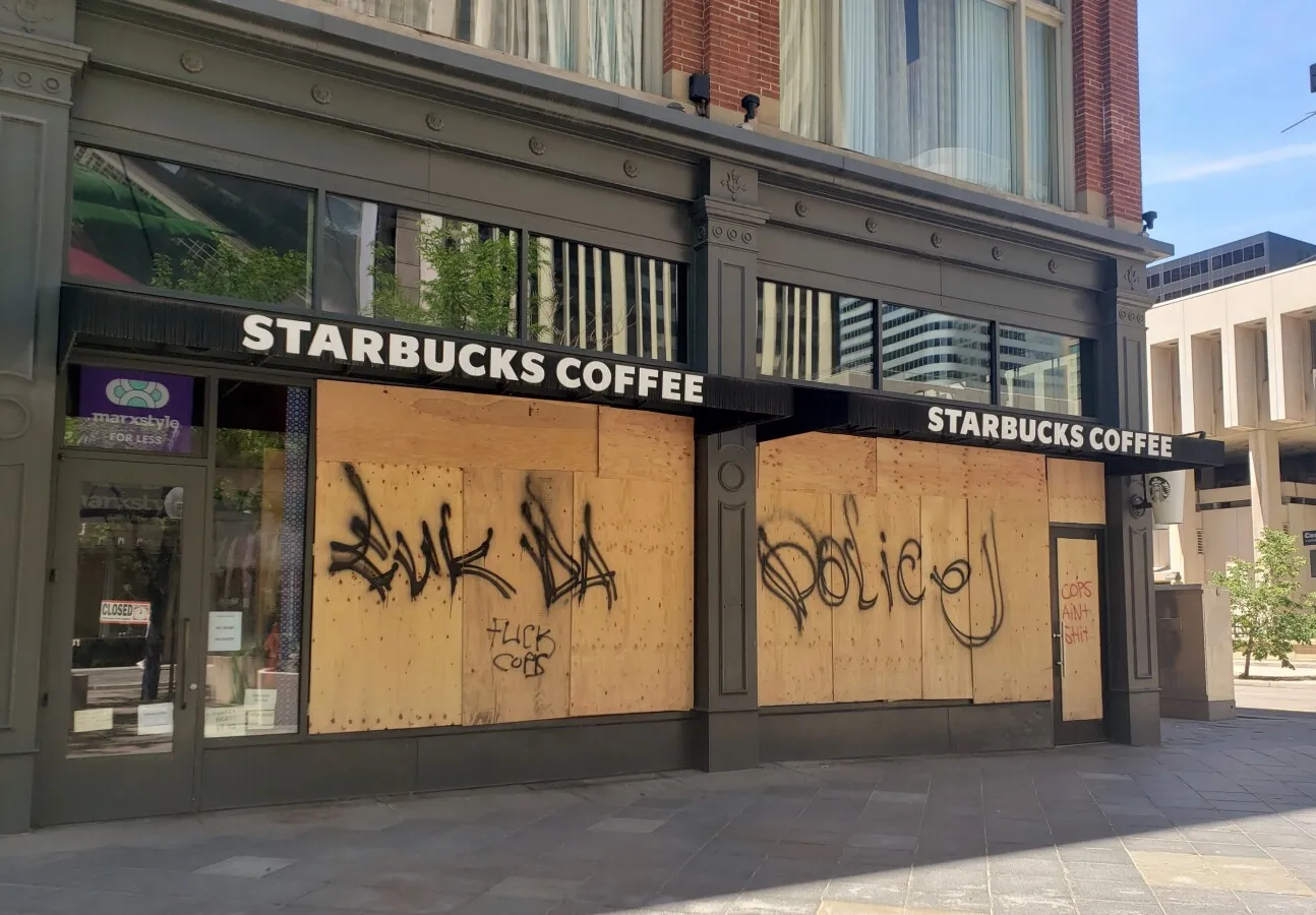 Windows boarded up after a protest got out of control