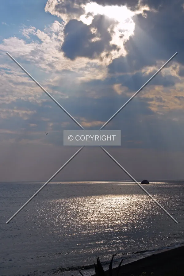 streaming sunlight over the ocean