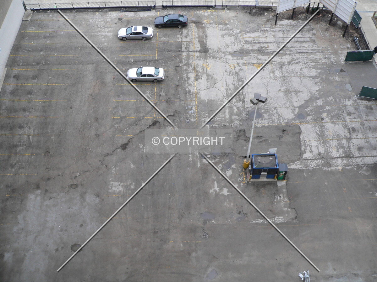 Looking at the parking lot/site from a nearby parking garage