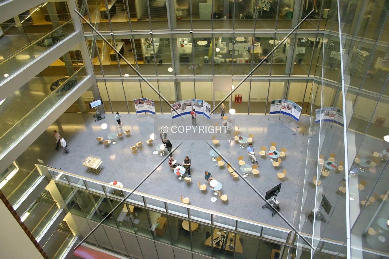 Looking down to the third floor breakout area from a seventh floor balcony