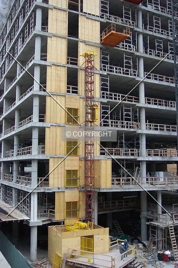 View of the north side and the temporary construction elevator shaft