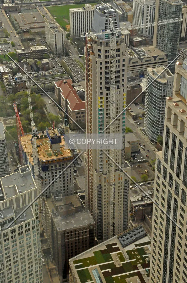 Looking down from the observatory at the John Hancock Center. 10 East Delaware is also seen under construction to the left
