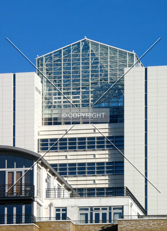 Detailed view of the glass enclosure at the tower's crown