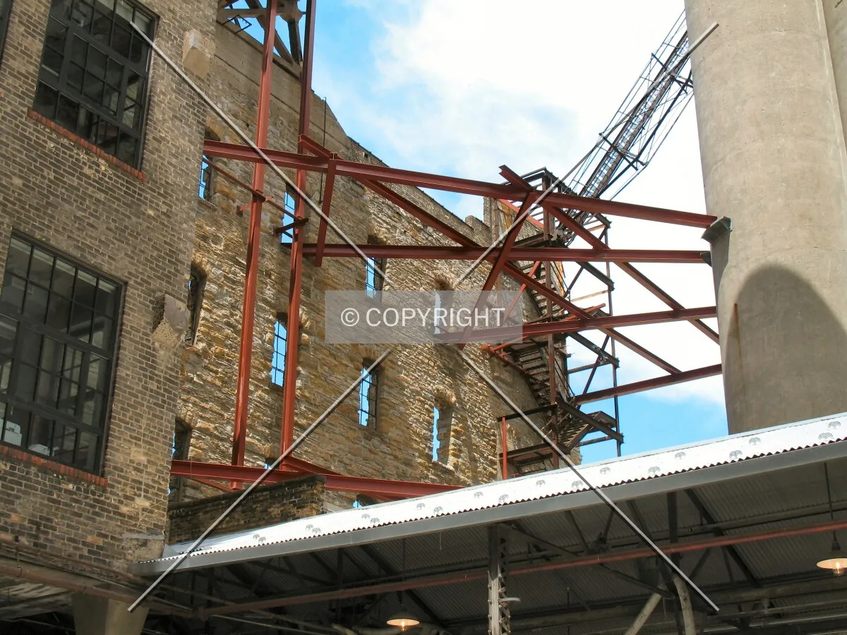 Steel girders supporting the east wall of the mill ruins