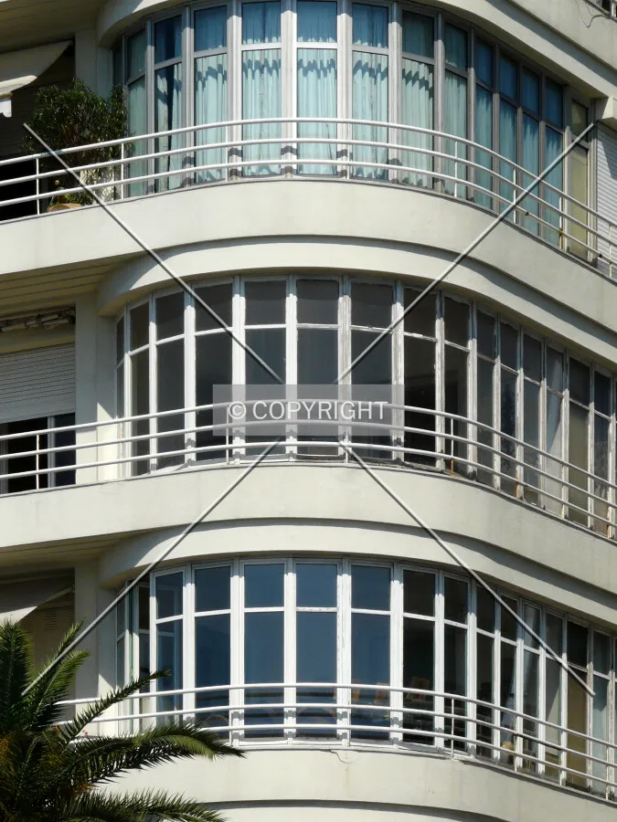 The rounded glassed corner, one of the characteristics of early modern buildings in Nice