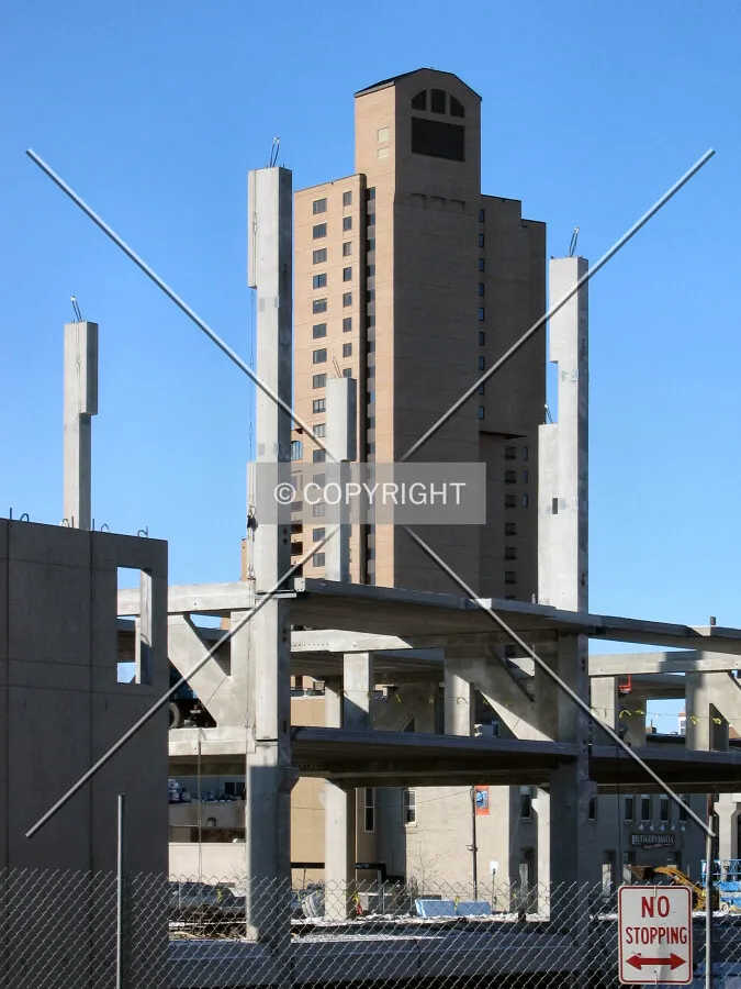 View to the west from Central Avenue SE, structural columns framing the Falls and the Pinnacle in the distance