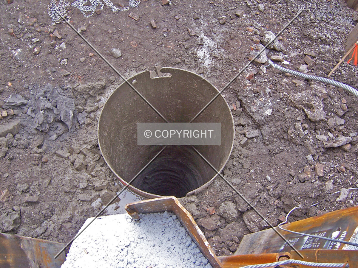 Looking down into a drilled caisson shaft in the southeast corner of the site