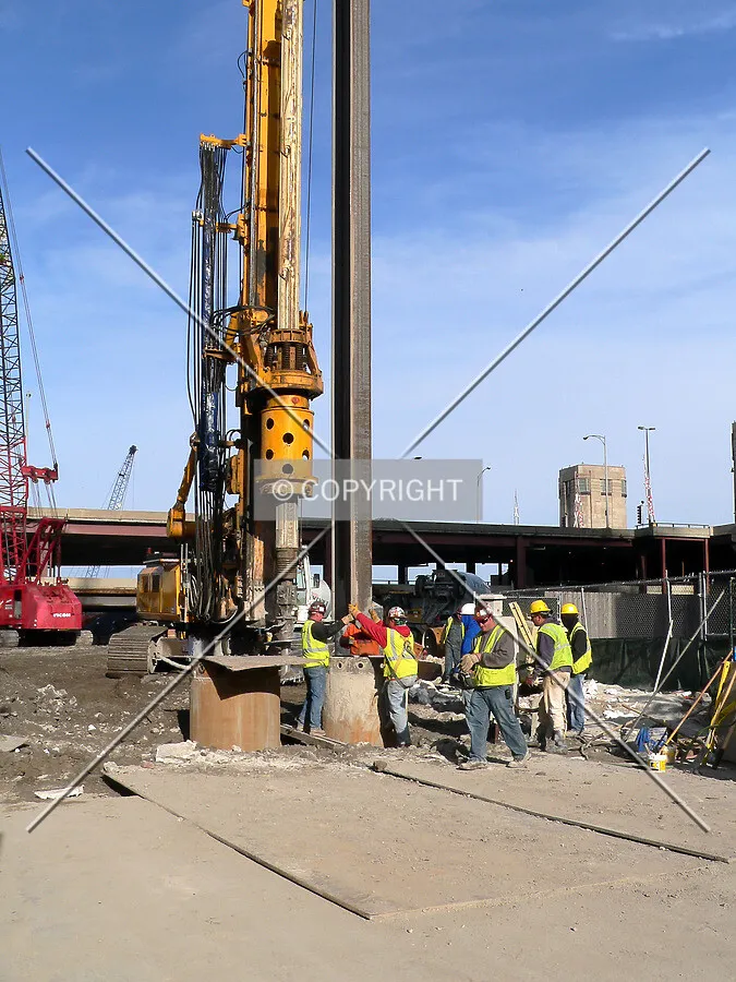 Guiding a steel beam into a secant pile hole