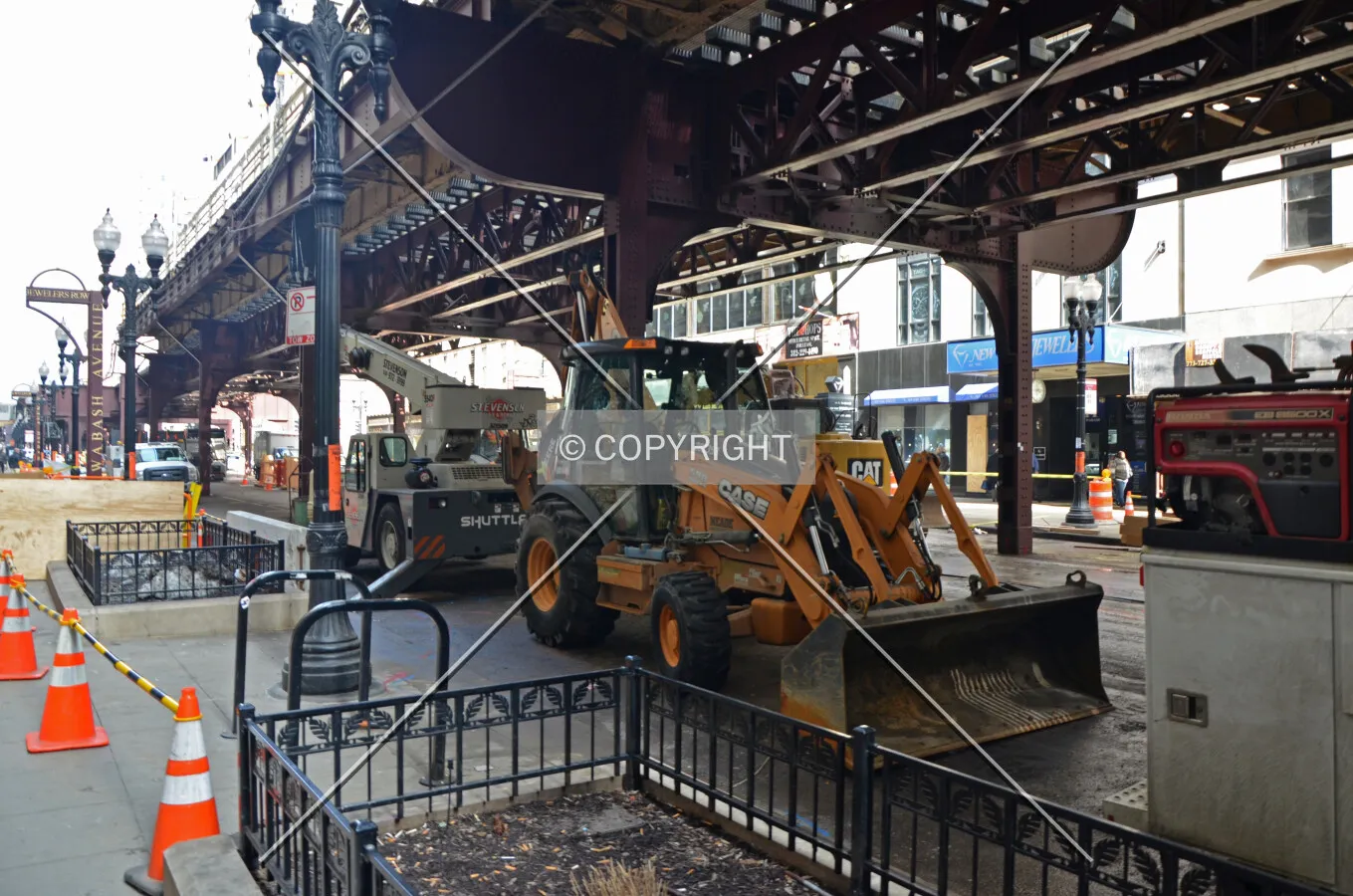 Workers performing utility work in Wabash Avenue in preparation for the station's demolition; March 10, 2015.