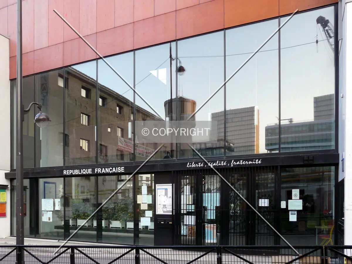 School entrance on Rue Primo Levi, with reflections of the nearby buildings