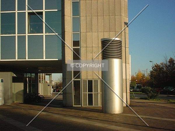 In front of the entrance (left)