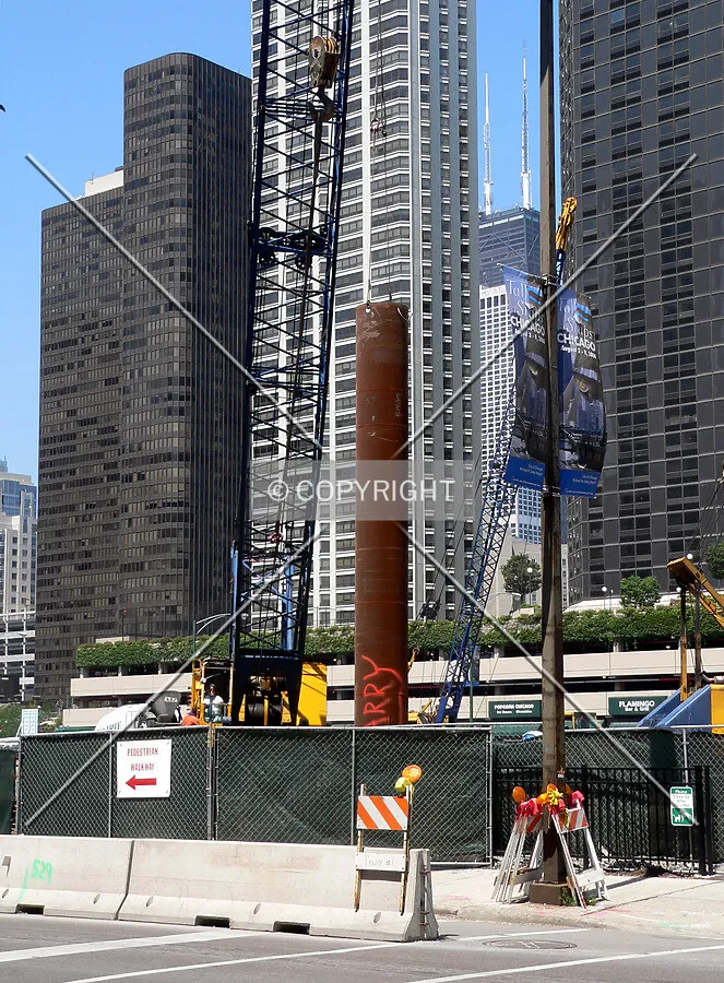 Installing a caisson tube in the southeast corner of the site