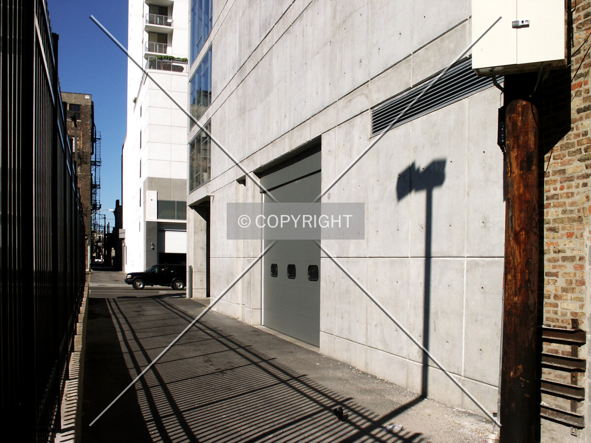 West wall along the alley