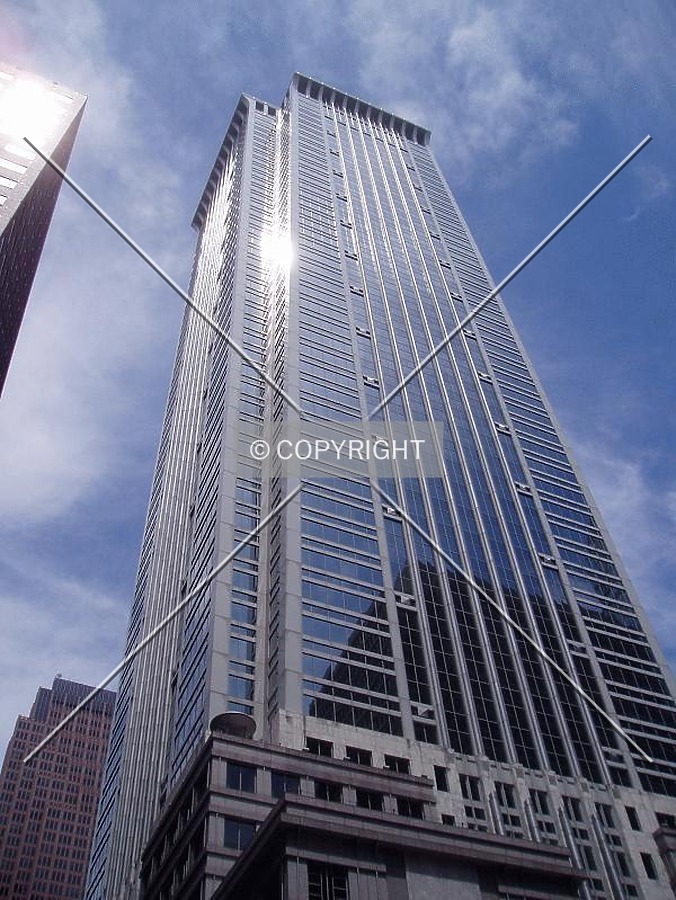 From below at 18th & Market, with Ten Penn Center on the left and Verizon Tower in the background