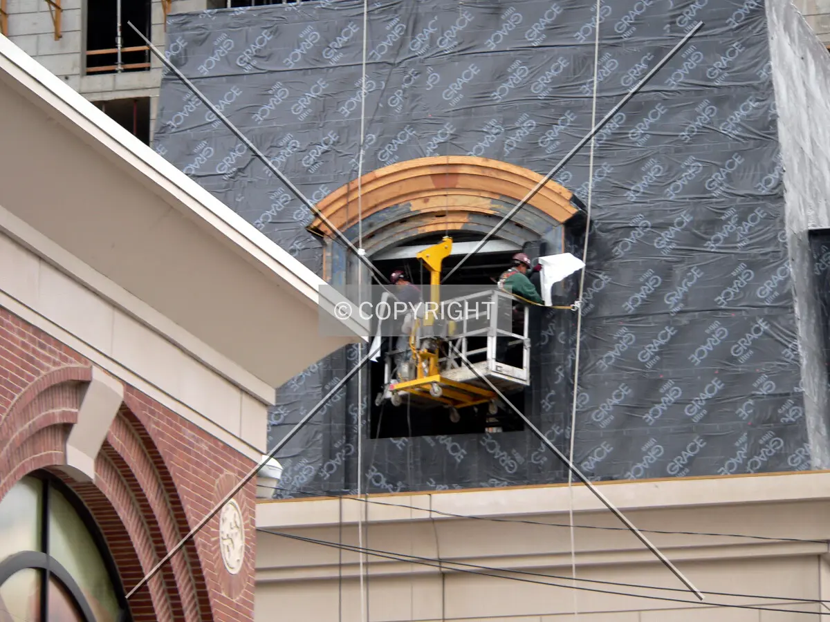 Covering a window frame with waterproof material