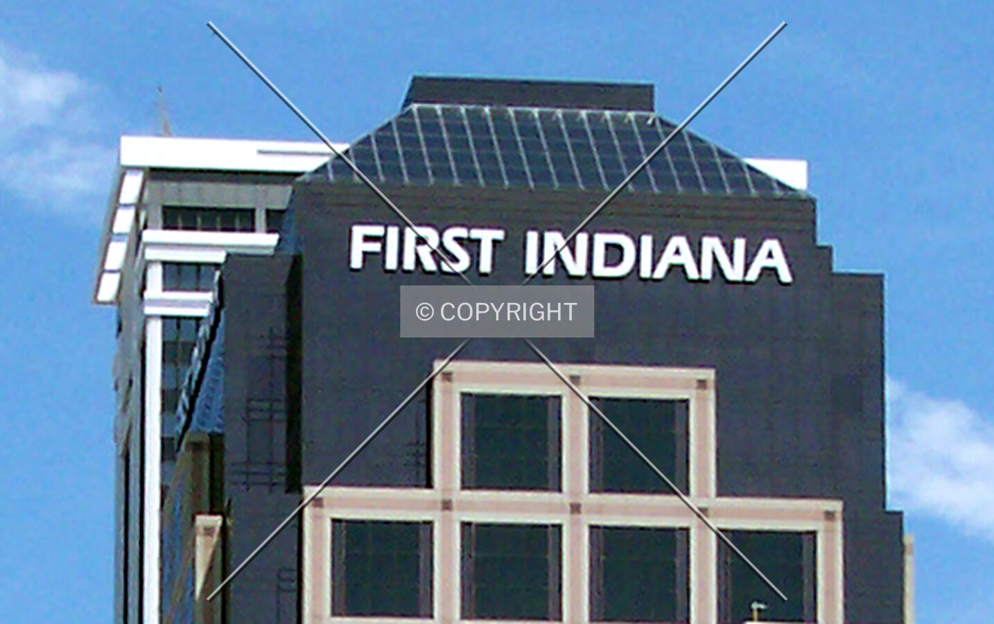 Upper floors and signage on the southern facade
