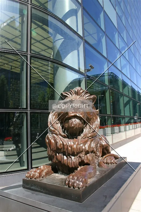 One of two lions which guard the entrance to the tower