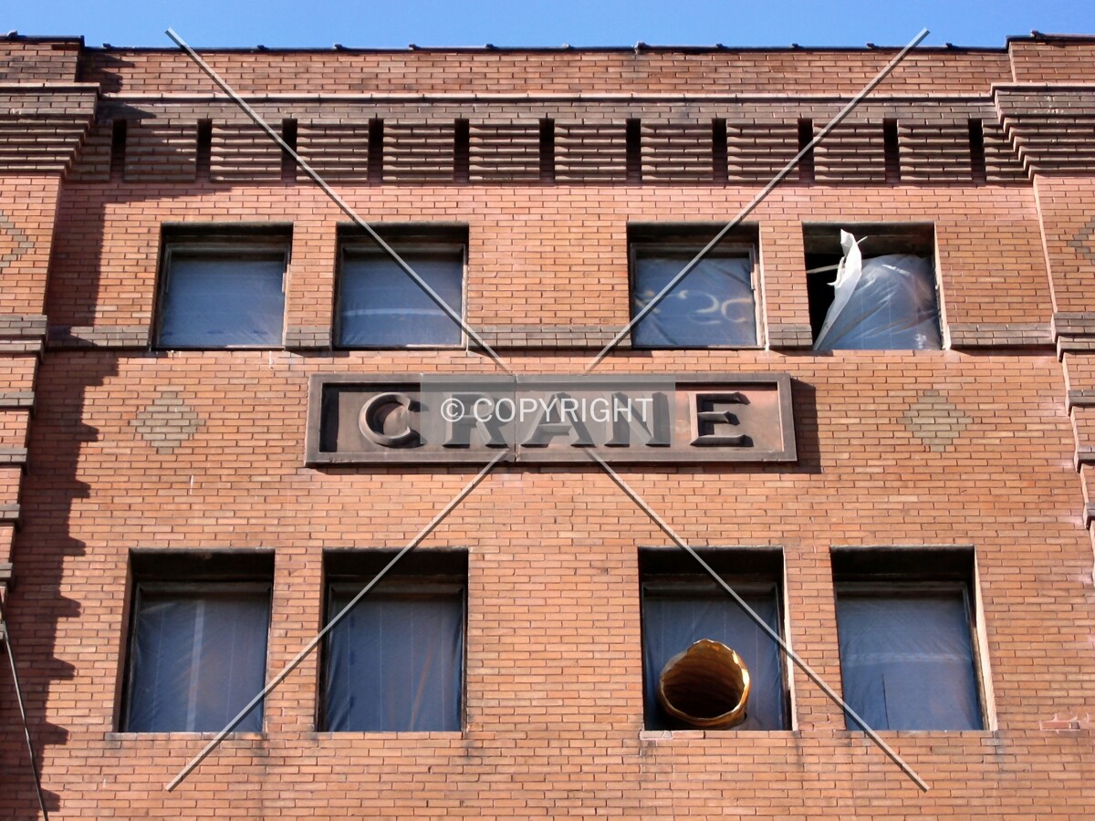 Looking up at relief of the name above East 5th Street