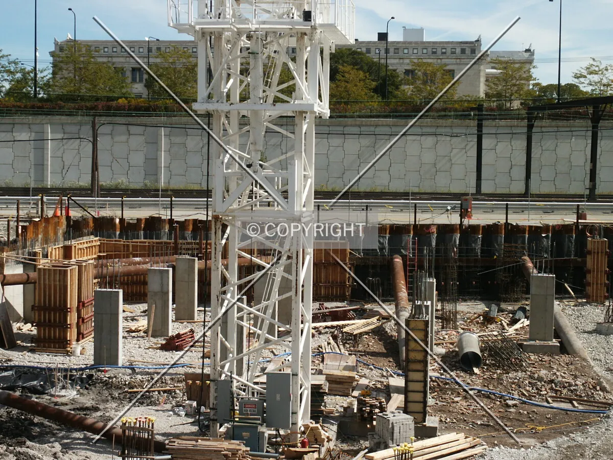 Base of the tower crane with the Field Museum in the background