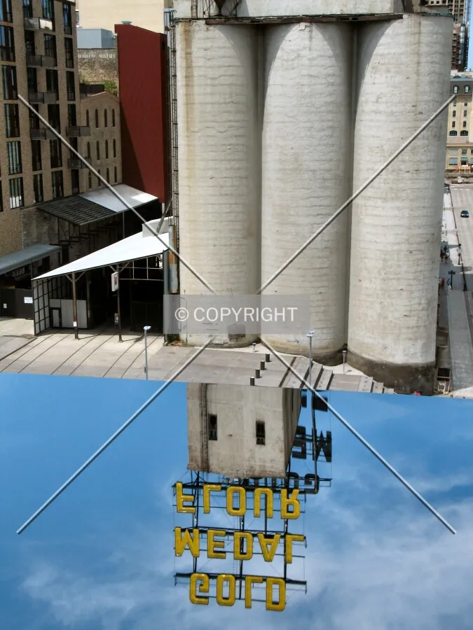 View to the west from one of the windows in the Endless Bridge; mirrored section at bottom reflects the neighboring Gold Medal Flour Elevator