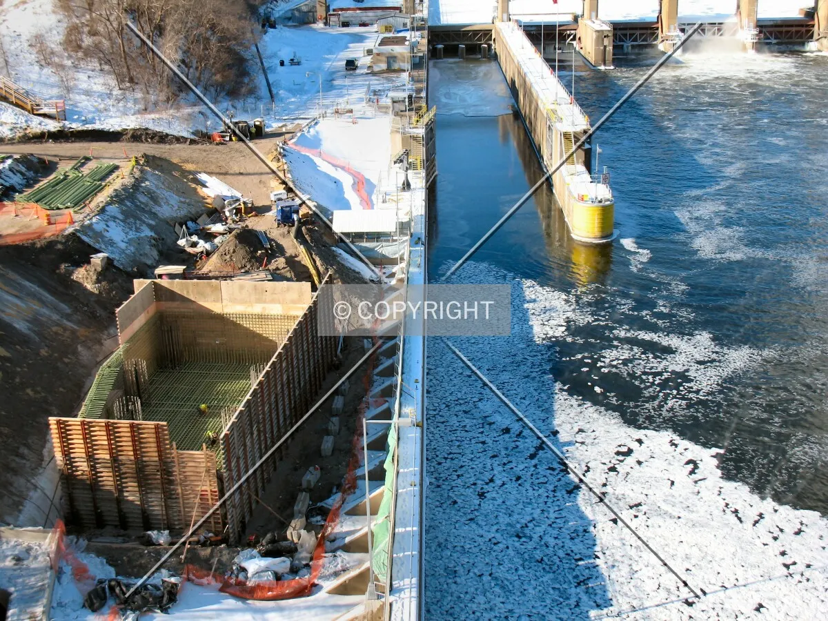 Ice on the Mississippi River, with the foundation pit for Pier 2