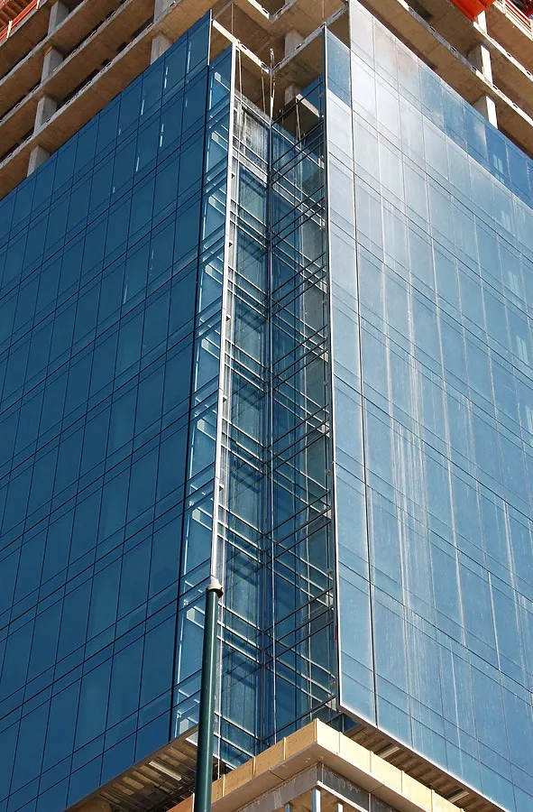West corner with glass curtain overhangs