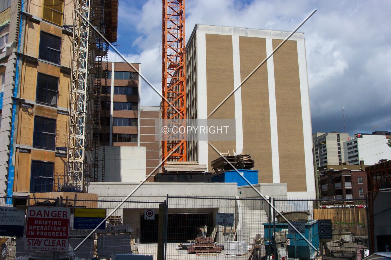 The front of the building, and in the background, the neighbouring existing building