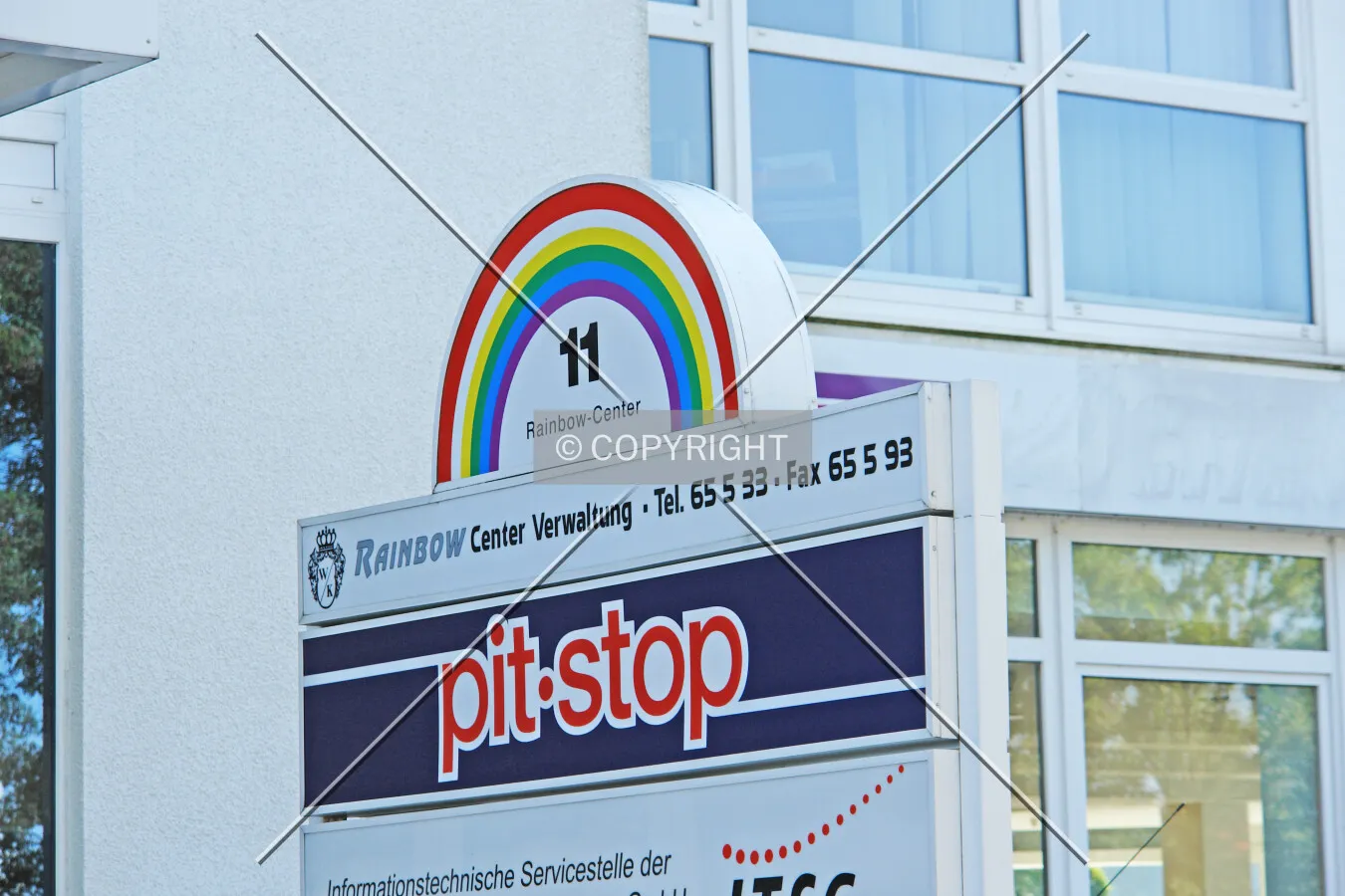 Rainbow Center building sign including contact information to center management