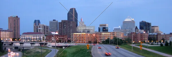 Twilight skyline view from John Ireland Boulevard