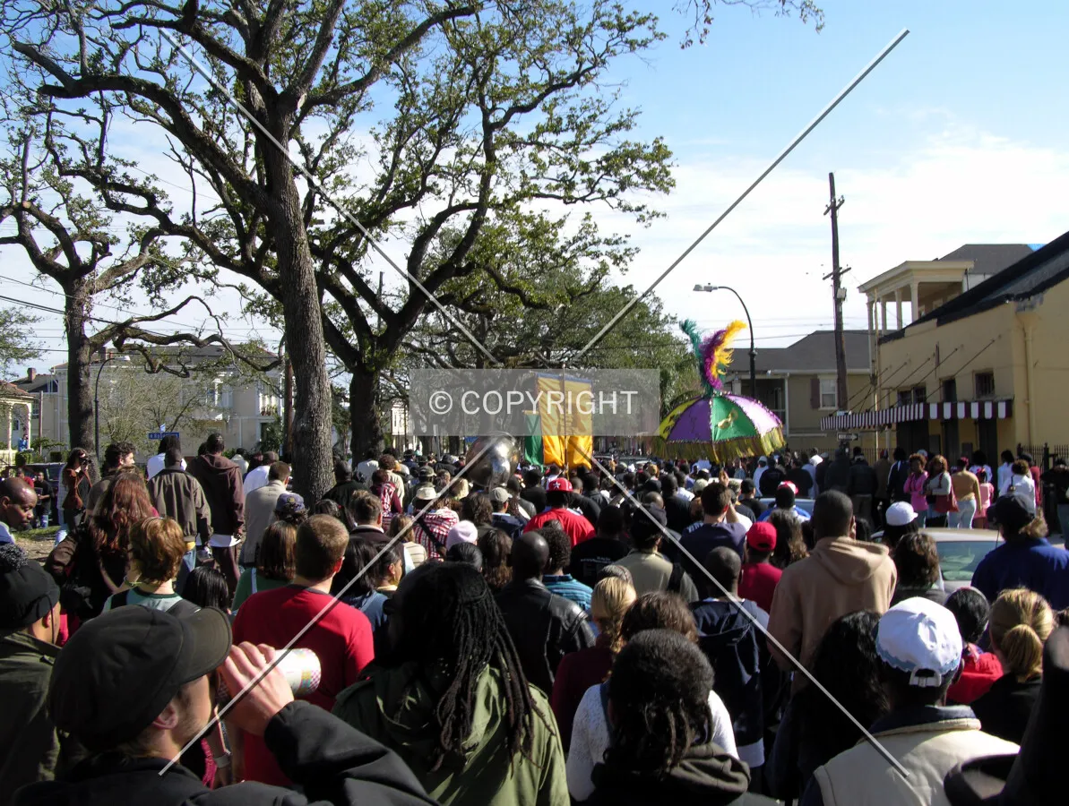 A New Orleans tradition, a Second Line parade marches on along Esplanade Avenue