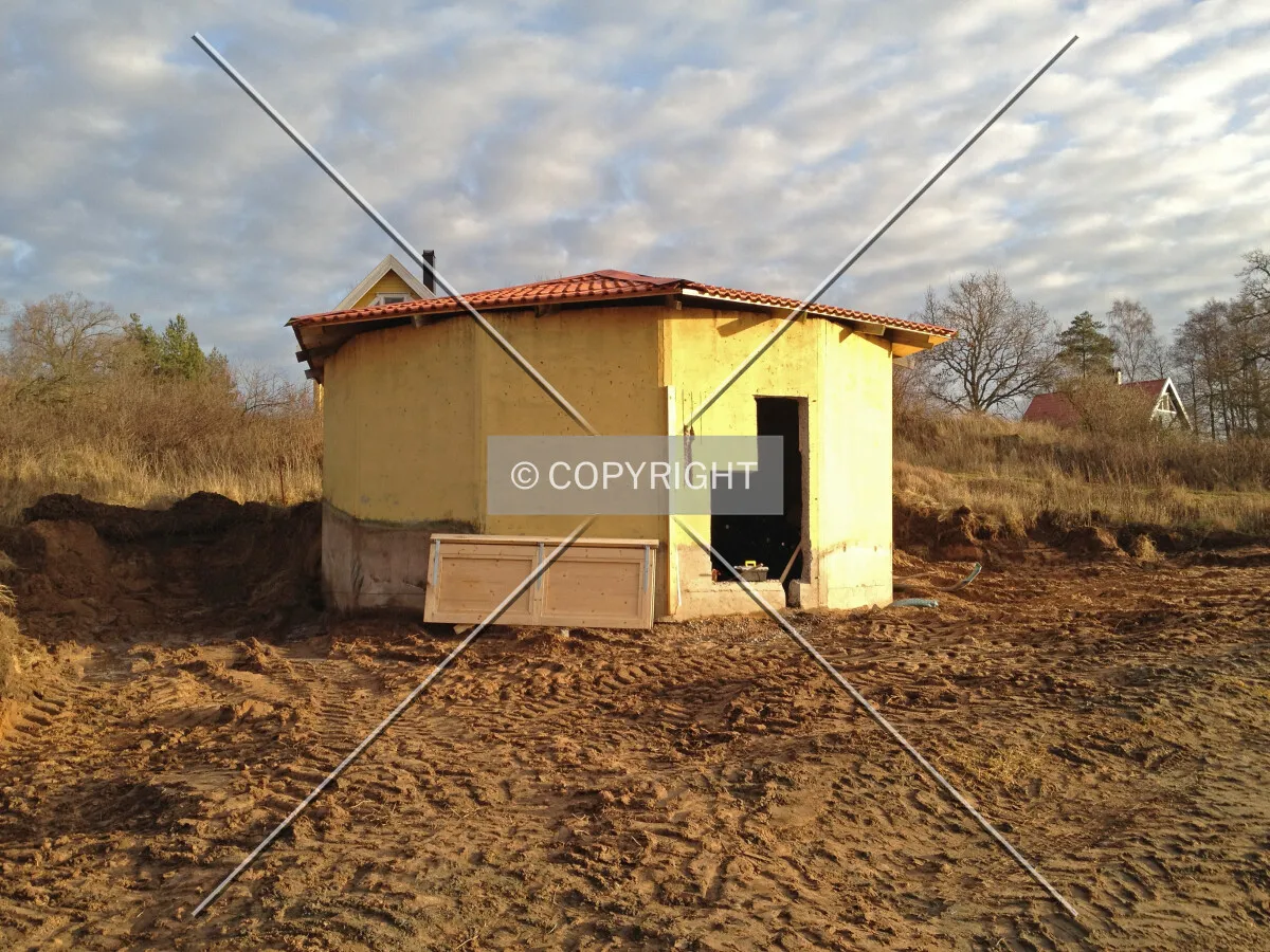 A concrete silo which was transformed into a storage shed