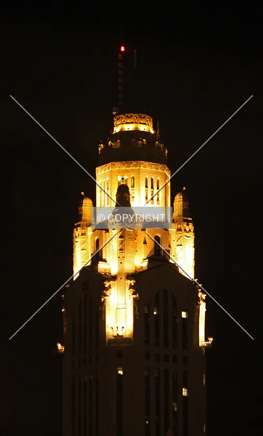 View of the upper floors at night from the southeast