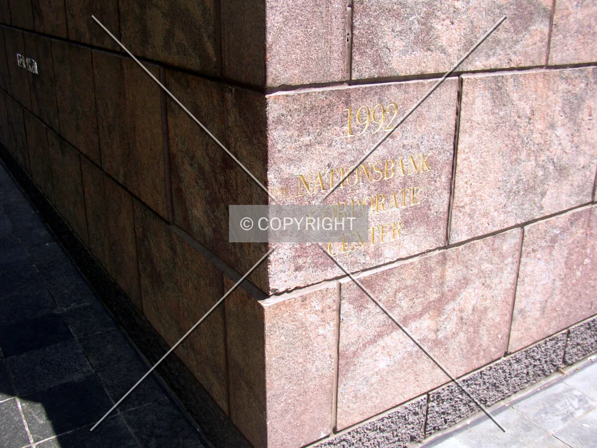 Dedication stone on the southwest corner off North Tryon Street