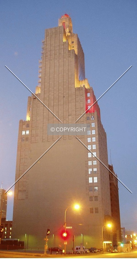 The entire windowless side of the building at twilight