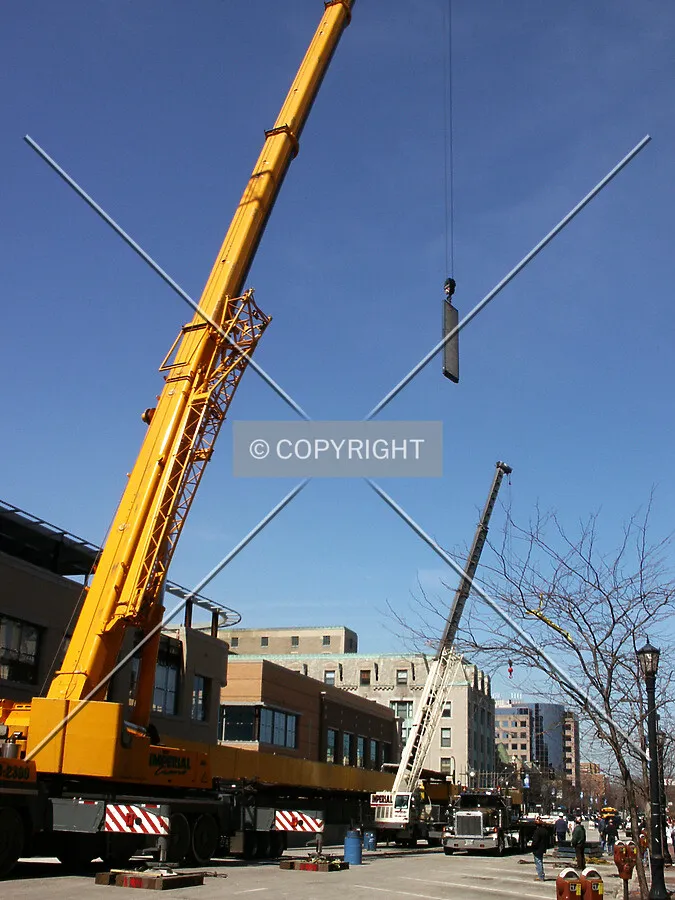 Lowering a counterweight onto Sherman Avenue