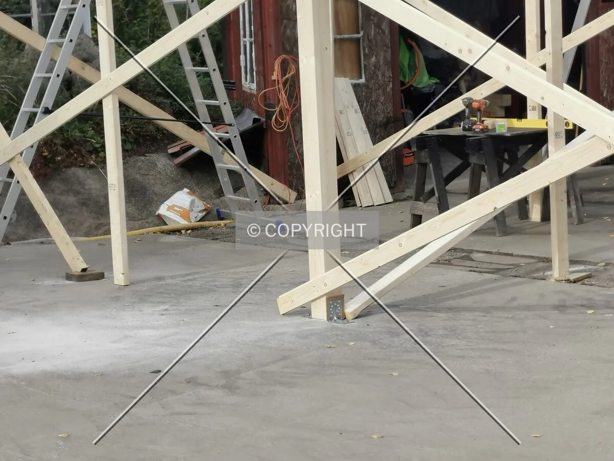A shed is constructed on a plain surface