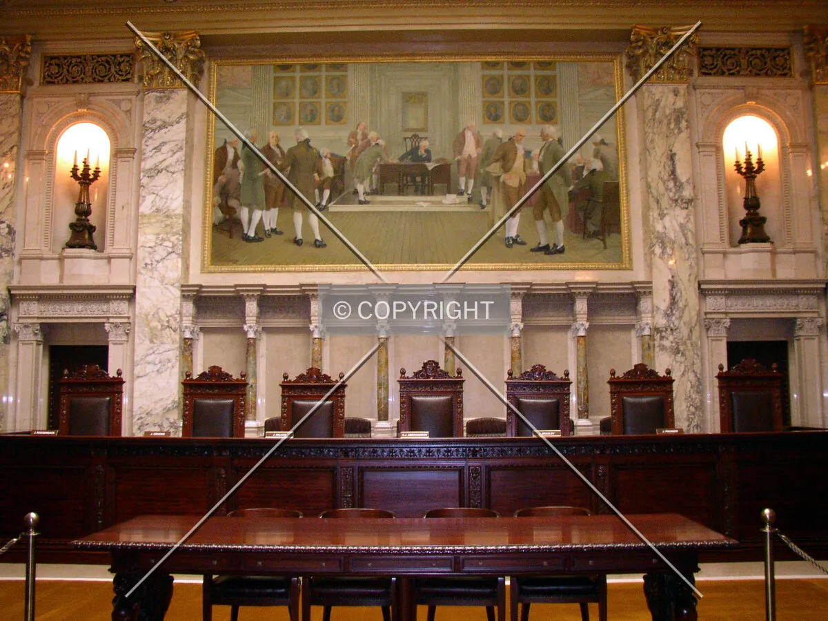 Judicial bench and mural dipicting the signing of the signing of the United States Constitution on the eastern side of the Wisconsin State Supreme Court