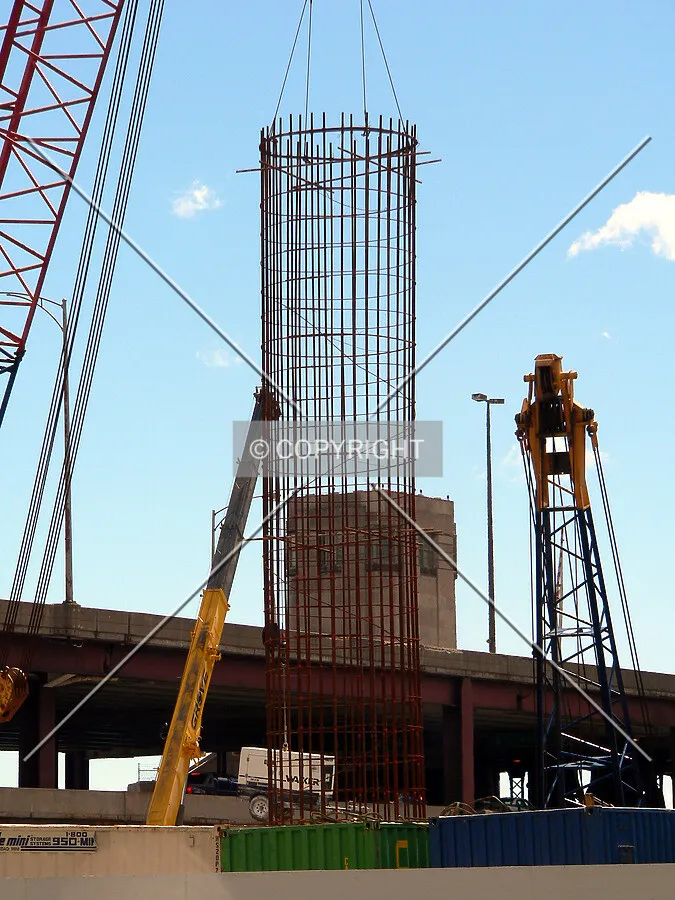 Lowering a rebar cage into position