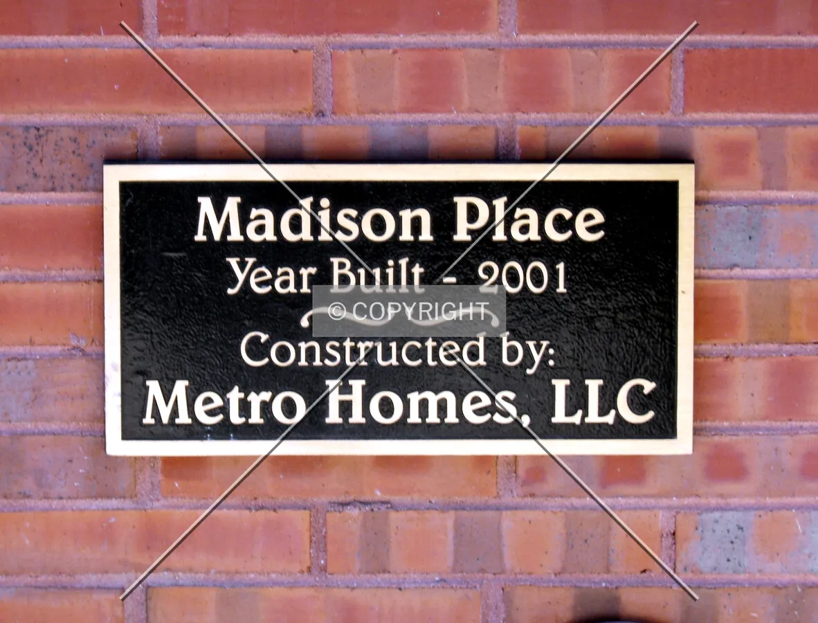 Plaque at main entrance on Madison Street