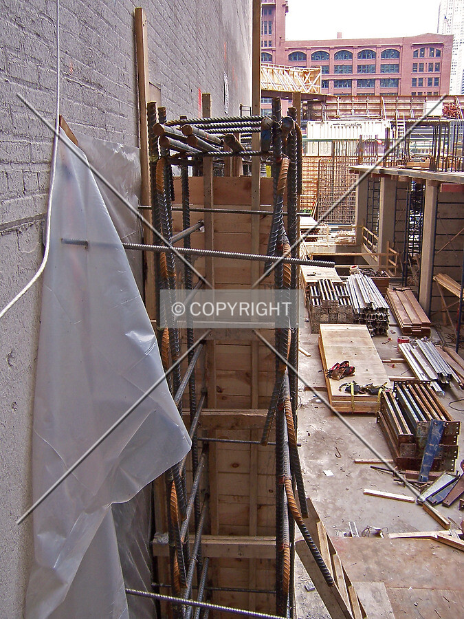Rebar and formwork for a shear wall on the western edge of the site. Viewed from the alley to the south
