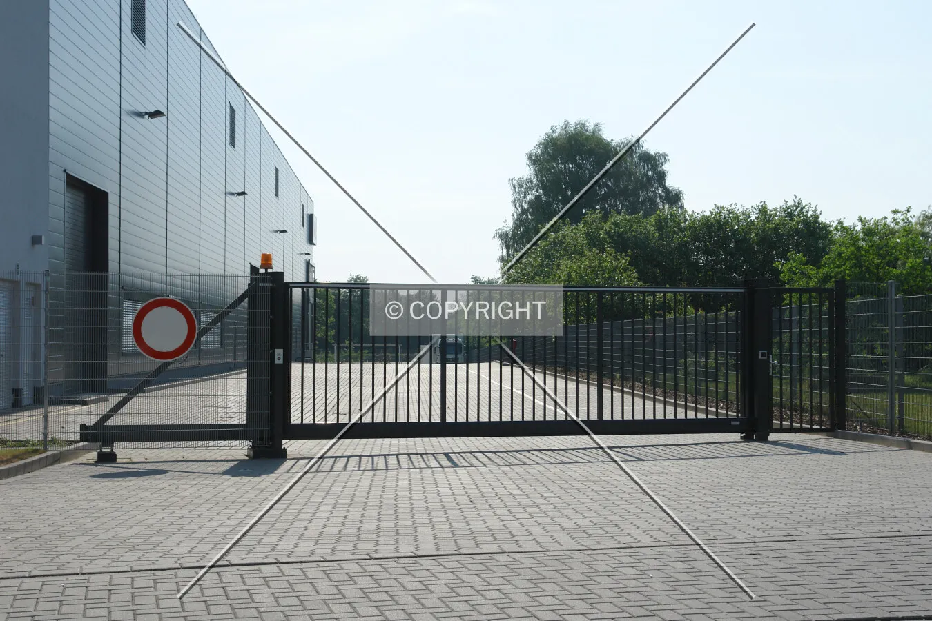 A closed gate to a commercial site