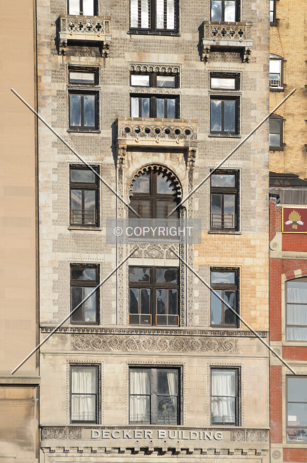 Close view of building facade, with art deco details