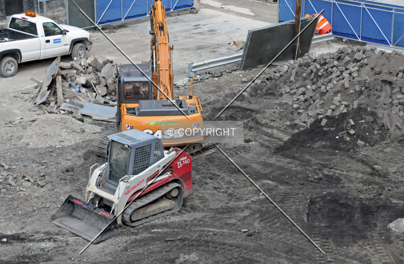 Equipment tearing up the surface parking lot