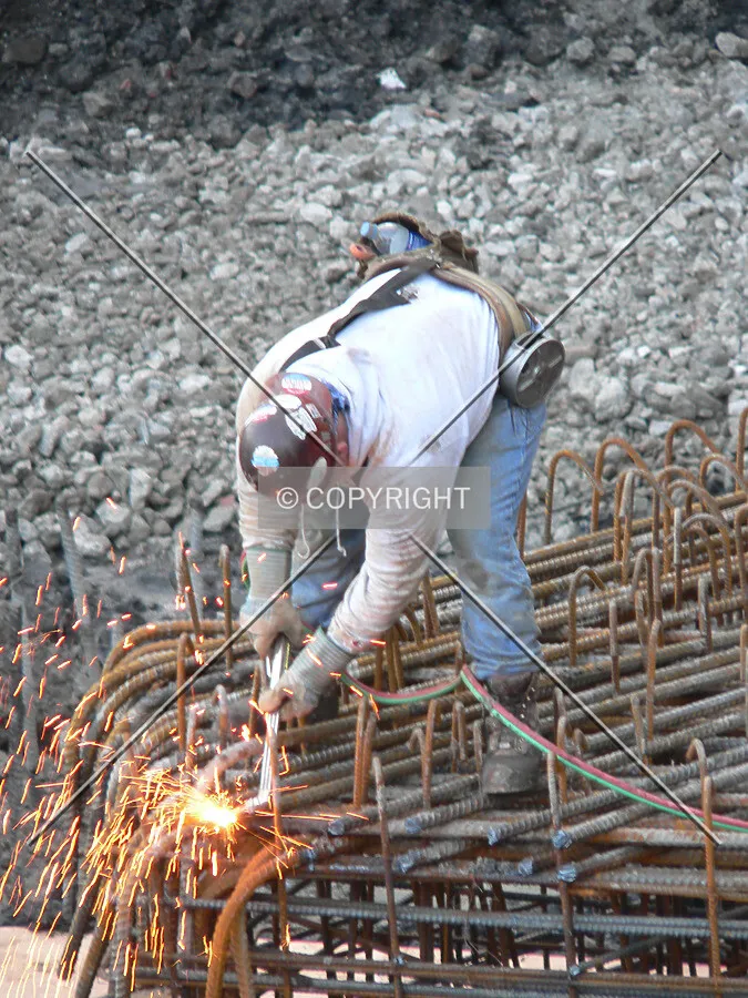 Ironworker welding rebar
